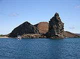 Galapagos 6-2-02 Bartolome Pinnacle Rock The large black partially eroded lava formation of Pinnacle Rock was created when magma expelled from the volcano reached the sea. When the seawaters cooled the hot lava it caused an explosion. The exploded particles eventually fasten together forming a rock composed of thin layers.